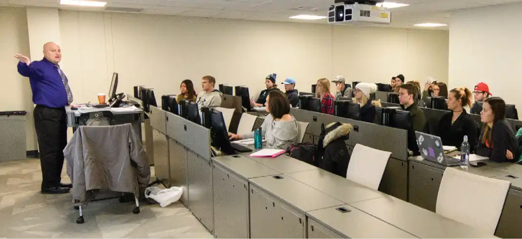 A Northwood University professor teaching a full lecture hall on the Midland, Michigan campus