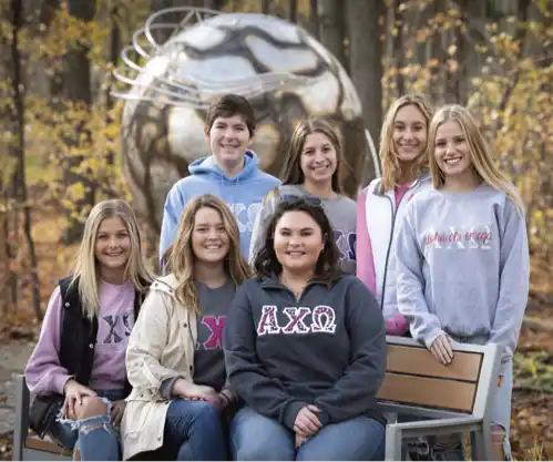 Members of a Northwood University student organization posing together on campus