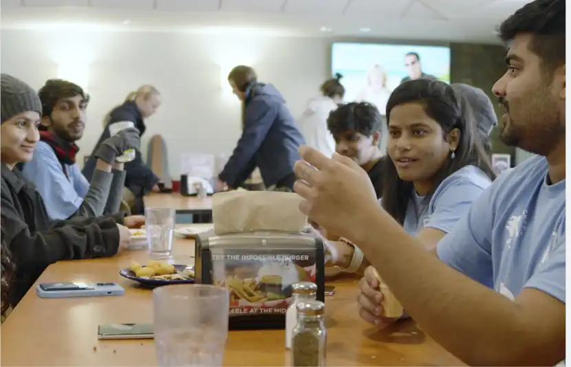 Northwood University students sharing a meal together in the campus dining hall